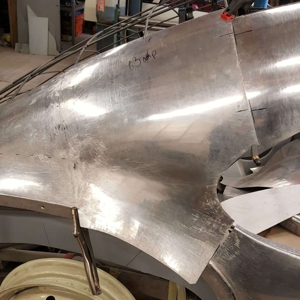 One side of the 1953 Jowett Jupiter restoration is well underway, and the mesmerising flowing fastback shape is starting to take shape and become a reality.