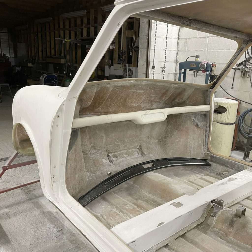 The original screen flanges on the Mini Sprint were in poor condition with inconsistent trimming and chips. We knew we had to step up and do better as part of our restoration.