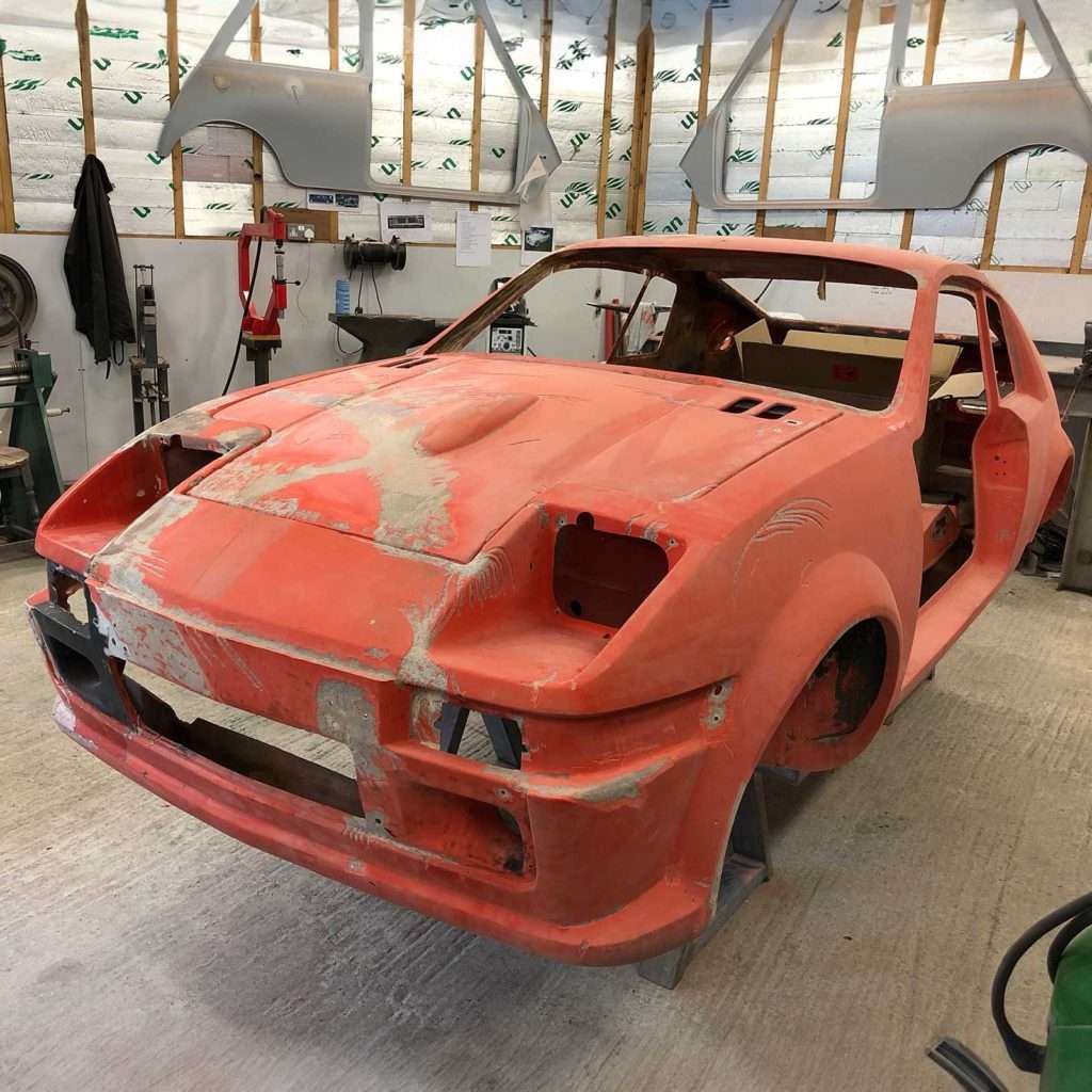 The damage on the bonnet tells a tale mirrored across the entire front of this Midas MkII. Consistency in restoration means addressing every facet, ensuring a comprehensive revival.